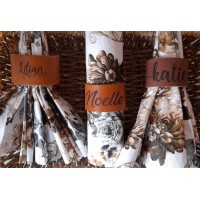Personalised leather napkin rings, engraved with names or short phrases