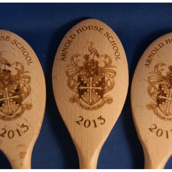 Wooden spoon engraved with company logo or phrase